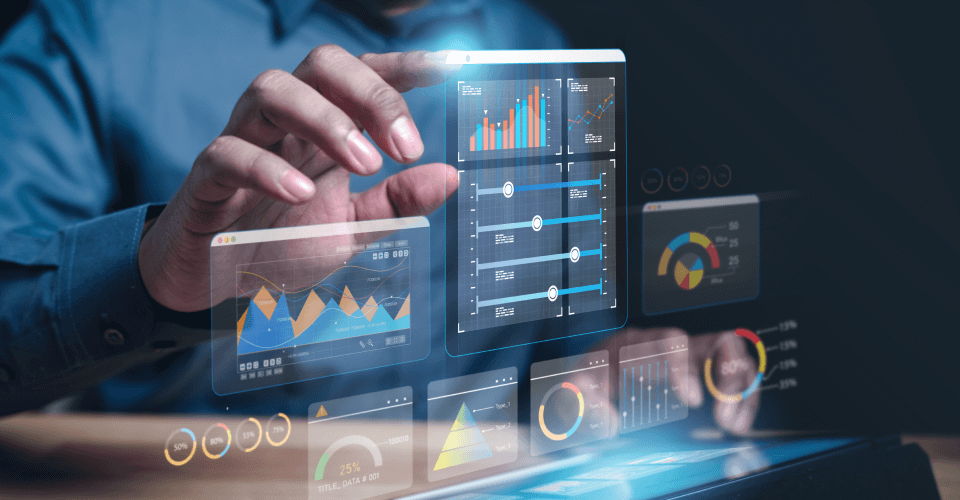 A professional analyzing financial data on a transparent futuristic touchscreen device, displaying interactive charts and graphs that indicate business analytics and performance metrics.