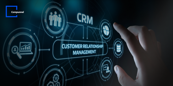 Digital graphic concept of Customer Relationship Management (CRM) with a hand interacting with virtual interface. Icons related to CRM such as analytics, communication, and support are connected by lines. The logo of 'Compunnel' is in the top left corner, indicating the company associated with the image.