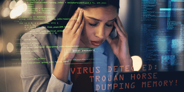  A woman looks distressed, holding her head in her hands in front of a computer screen, which displays code and a warning message about a virus detection and a Trojan Horse memory dump.